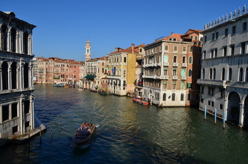 Bridge View of Tourists on a Boat at the Canal in Venice, Italy