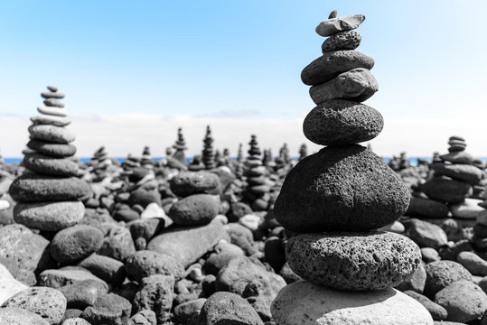 Volcanic rocks stacked, apachetas, near the beach Jardin in Puerto de la Cruz, Tenerife. Canary Islands