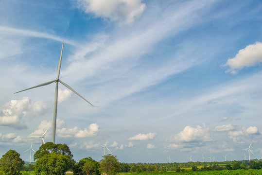 Wind turbines generating electricity with blue sky