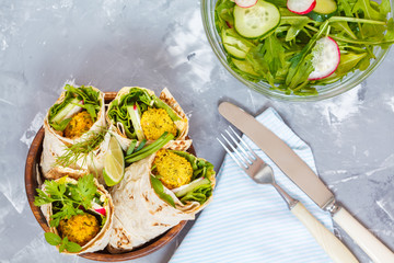 Vegan falafel wraps with salad and hummus. Love for a healthy vegan food concept.
