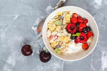 Greek yogurt with berries and muesli. Healthy breakfast concept.