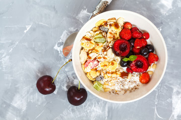Greek yogurt with berries and muesli. Healthy breakfast concept.