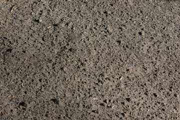abstract texture background brightly lit asphalt closeup