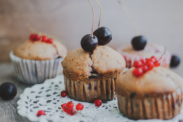 sweet homemade muffins stuffed with cherries and red currant