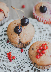 sweet homemade muffins stuffed with cherries and red currant