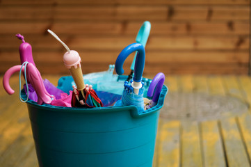 Colorful Umbrellas in a Bucket