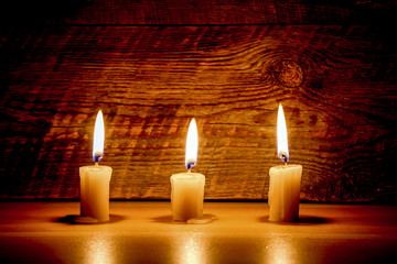 candles on old wooden background