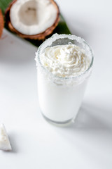 cocktail with coconut on white background