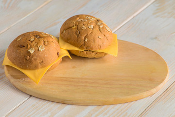 bread buns on wooden board
