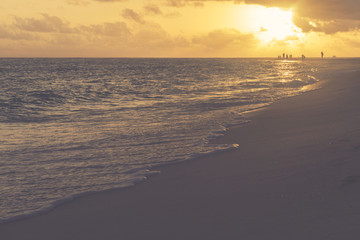 Dramatic sunset over tropical beach and sea