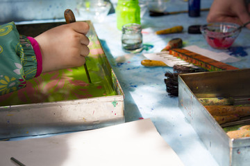 Ebru art. Traditional Turkish Ebru technique. Painting on water, followed by paper prints. Color paint ebru with waves and tile pattern.