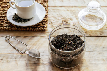 Tea set on the wooden table at sunny morning