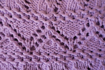 Closeup of lavender handmade knitted fabric with zigzag pattern