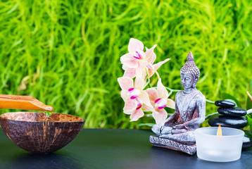 Zen garden background with buddha, orchid flower and zen stones