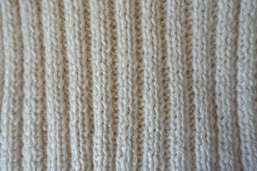 White handmade knitted fabric with vertical wales