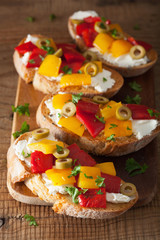 italian bruschetta with roasted peppers goat cheese olives