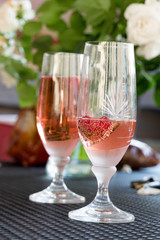 Wine glasses on table at garden in a sunny day