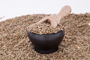 Raw lentils on white background