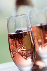 Wine glasses on table at garden in a sunny day