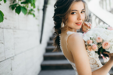 Stunning bride in the old garden at summer