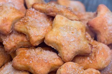 Cookies of different shapes with sugar for a Golden crust.