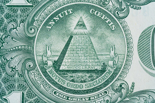 The pyramid and eye on the back of a one dollar bill macro - Close up great seal 