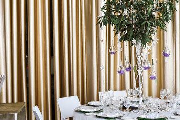 Wedding floral decorations hanging from decorative tree