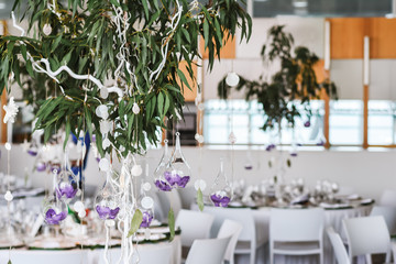 Wedding floral decorations hanging from decorative tree