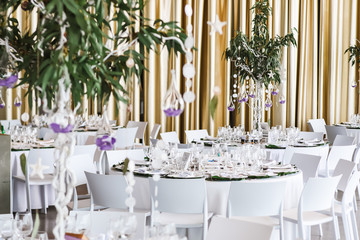 Restaurant tables decorated for wedding celebration