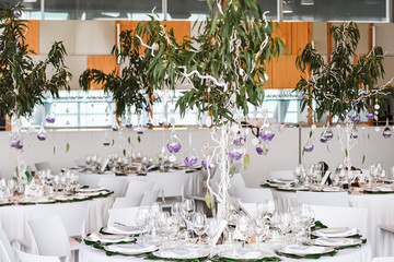 Restaurant tables decorated for wedding celebration