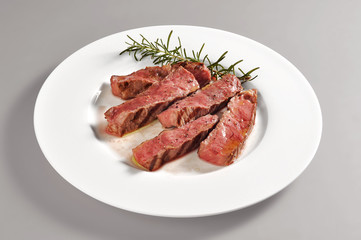 Plate with grilled steak portion