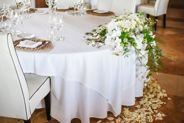 Restaurant round table decorated for wedding celebration