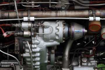 Different mechanisms on the body of aircraft engine.