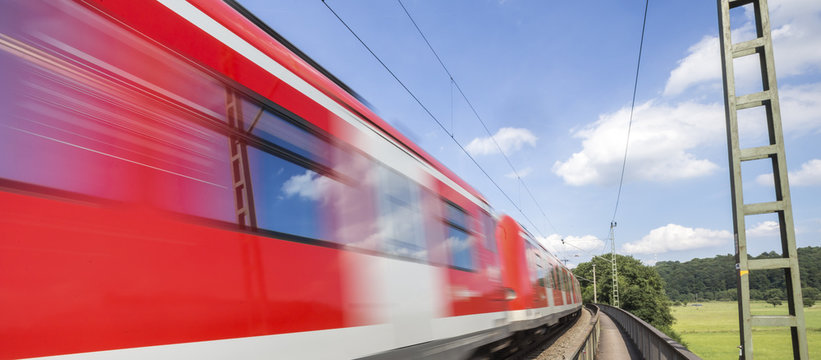 Fototapeta speed blurred passenger train outdoors