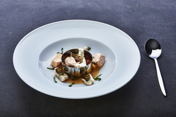 Fish soup cooking.on grey table 