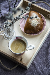 Breakfast in bed - coffee and biscuit on a wooden tray
