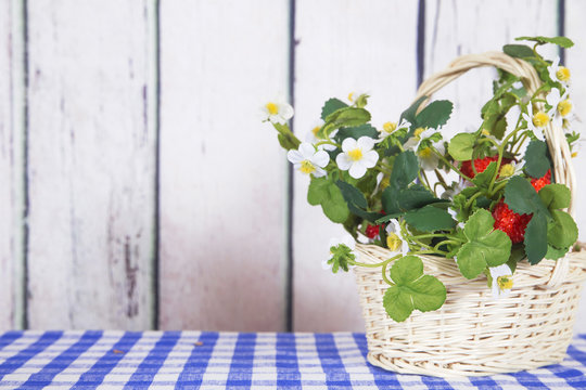 Little basket with strawberries .Decor