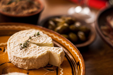 goats cheeses on a plate with lavendar