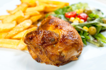 Fresh chicken with tomatoes and french fries