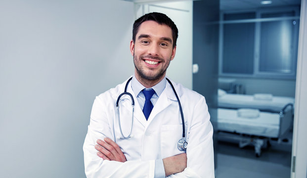 smiling doctor with stethoscope at hospital 
