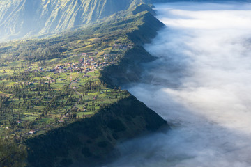 Cemero Lawang village in a morning with sea of mist, Bromo mountain, East Java, Indonesia