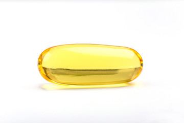 Close up a soft gel capsule on white background, natural fish oil supplements.