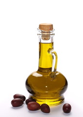 Glass bottle filled with olive oil isolated on white background