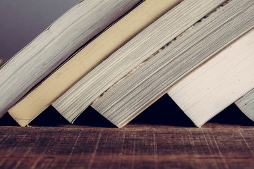 Naklejka premium The book is on a wooden table with filter effect retro vintage style