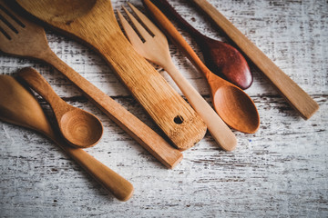 Wooden spoon on wood table with filter effect retro vintage style