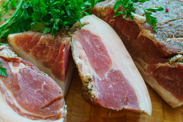 Pork pieces are salted in the traditional way.