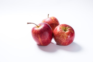 Three red apple on white background
