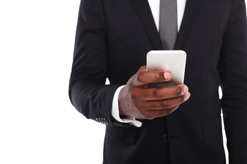 Unrecognizable businessman in suit with smartphone