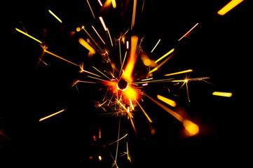 Fire Sparks With Motion Blur Effect Over Black Background