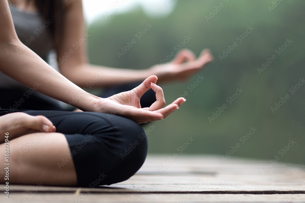 Wall mural close up of woman hand practice yoga